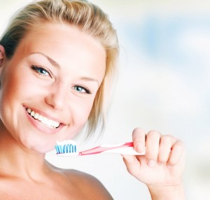 woman holding toothbrush