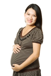 pregnant woman holding her belly