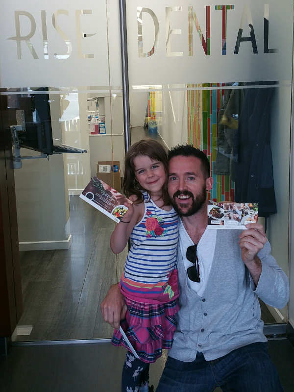 Neil, the latest referral reward winner for the monthly contest, posing with his daughter